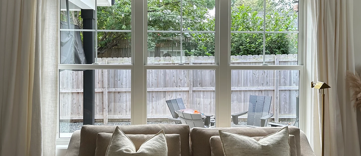 Clear picture window overlooking the backyard